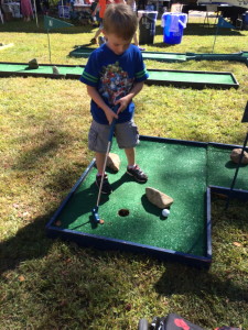 Playing a game of mini golf is a great family bonding experience plus it helps build gross and fine motor skills!