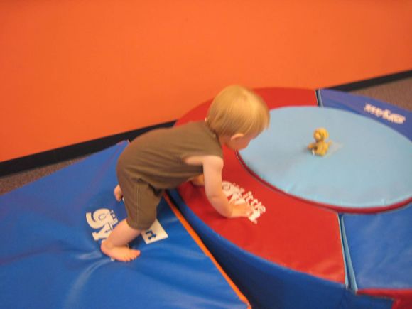 Mommy and Me Classes help kids increase their mobility by teaching them to climb up and over large mats and through tunnels!