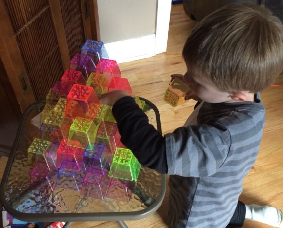 By carefully stacking each cup, kids build valuable fine motor and visual skills!