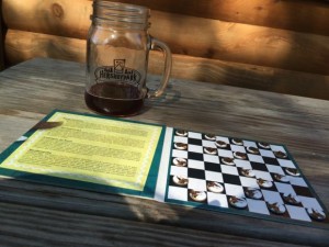 Playing Checkers is fun way to pass the time while camping!